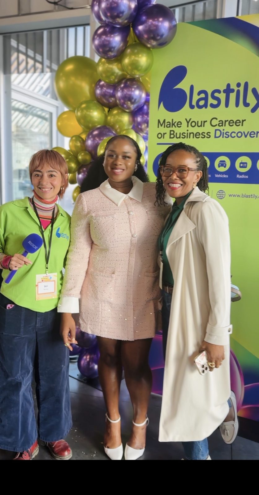 Guests smiling in front of the Blastily backdrop and purple and gold balloons at Toast Summit 2026